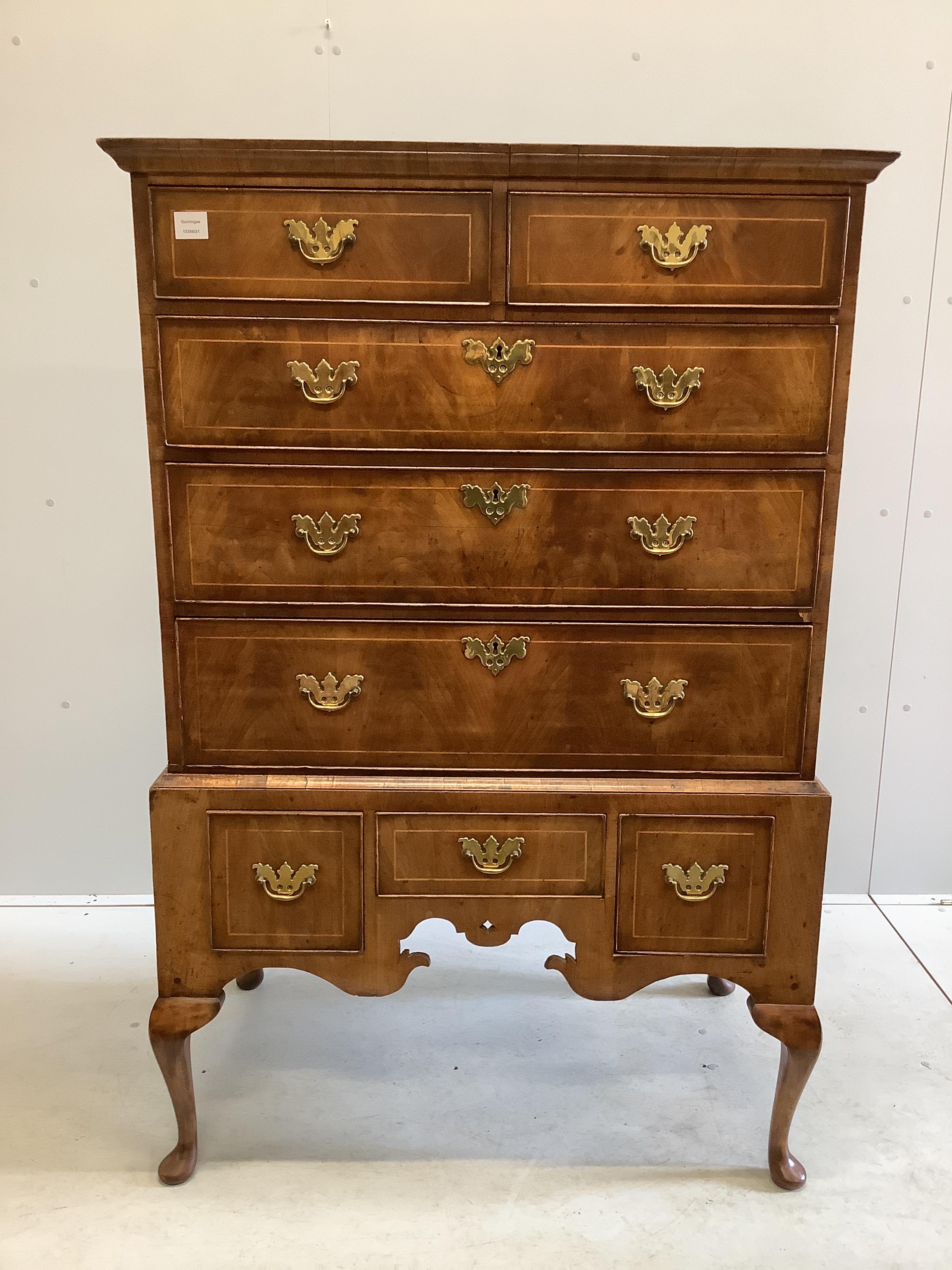 An 18th century walnut chest on stand, width 97cm, depth 56cm, height 146cm